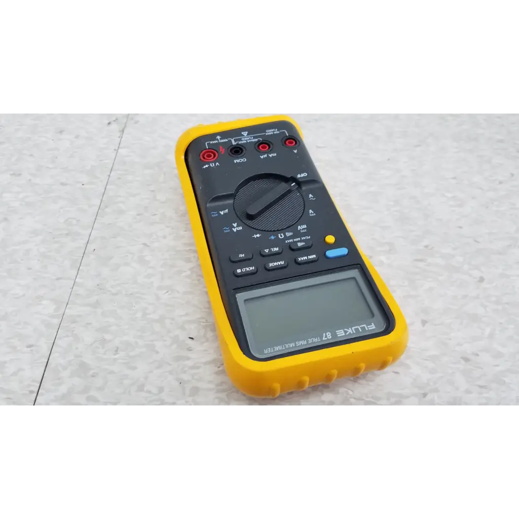 Yellow and black fluke 87 true rms digital handheld multimeter with digital display rotary dial and function buttons