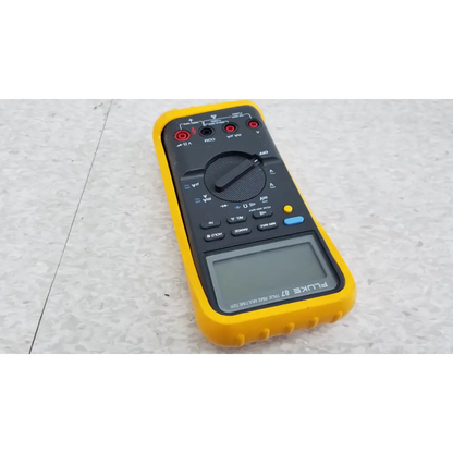 Yellow and black fluke 87 true rms digital handheld multimeter with digital display rotary dial and function buttons