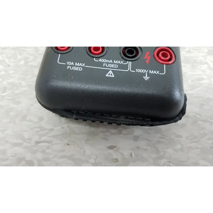 Black plastic fluke 87 true rms digital handheld multimeter with red and black test probe jacks for 1000v max measurements