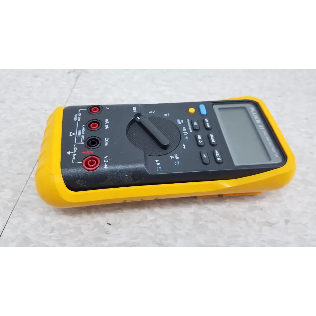 Yellow and black fluke 87 true rms digital handheld multimeter with red test probes for accurate electrical measurements