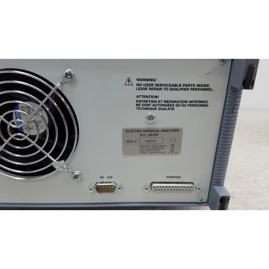White metal fluke biomedical qa-esii electrosurgery analyzer with black fan grille and serial number plate visible