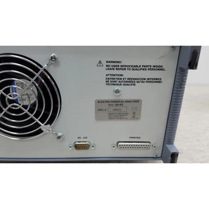 White metal fluke biomedical qa-esii electrosurgery analyzer with black fan grille and serial number plate visible
