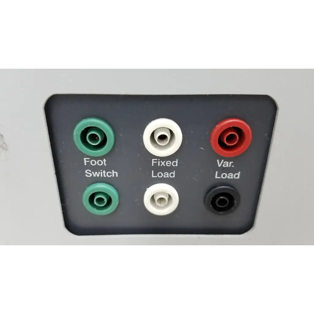 Back side of black fluke biomedical qa-esii electrosurgery analyzer with green white red and black audio jacks labeled foot switch fixed load and var