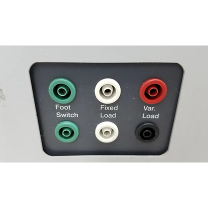 Back side of black fluke biomedical qa-esii electrosurgery analyzer with green white red and black audio jacks labeled foot switch fixed load and var