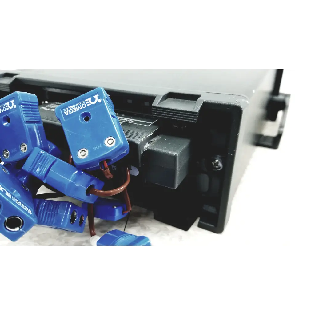 Blue plastic omega clamp connectors with metallic screws and copper wiring on the back of fluke hydra series ii data acquisition unit 2645a universal input module