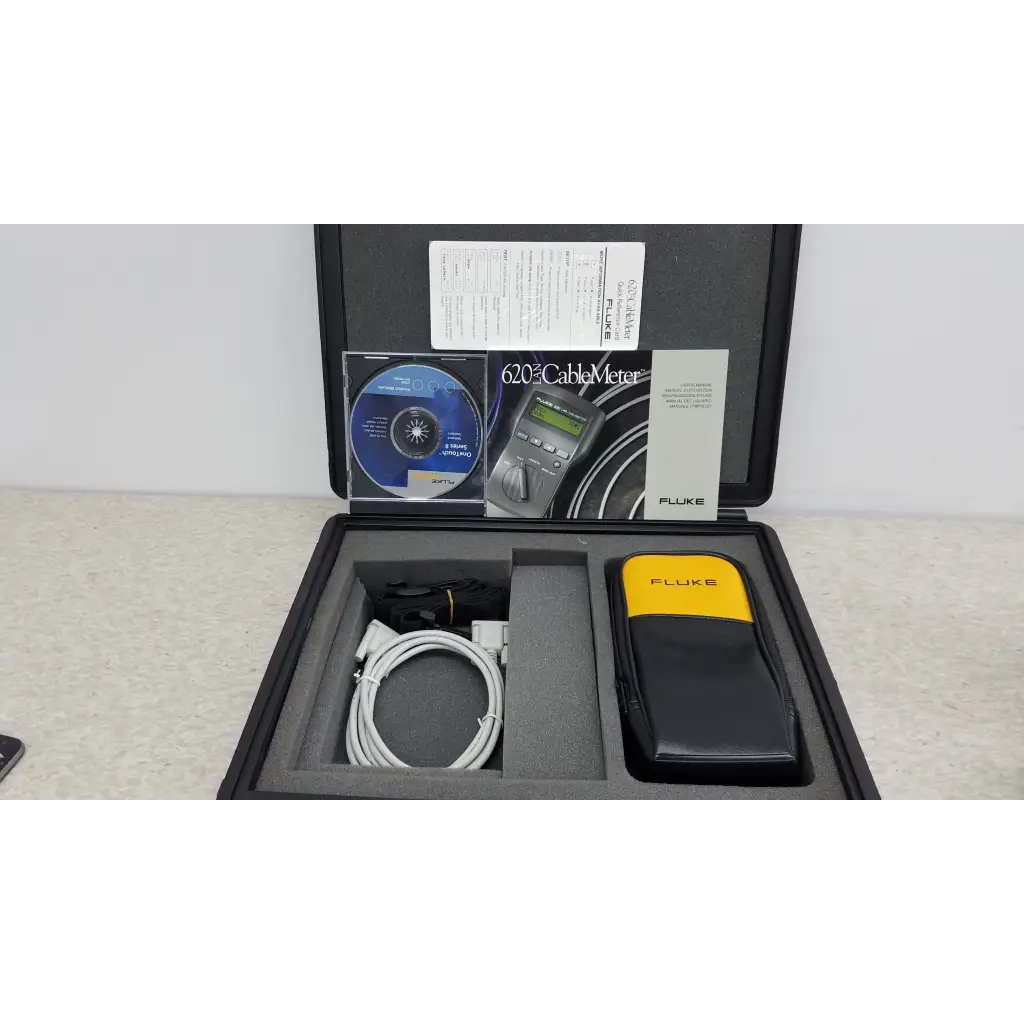 Fluke networks 620 lan cablemeter in black and yellow carrying case with coiled white cable for cable testing