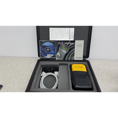 Fluke networks 620 lan cablemeter in black and yellow carrying case with coiled white cable for cable testing