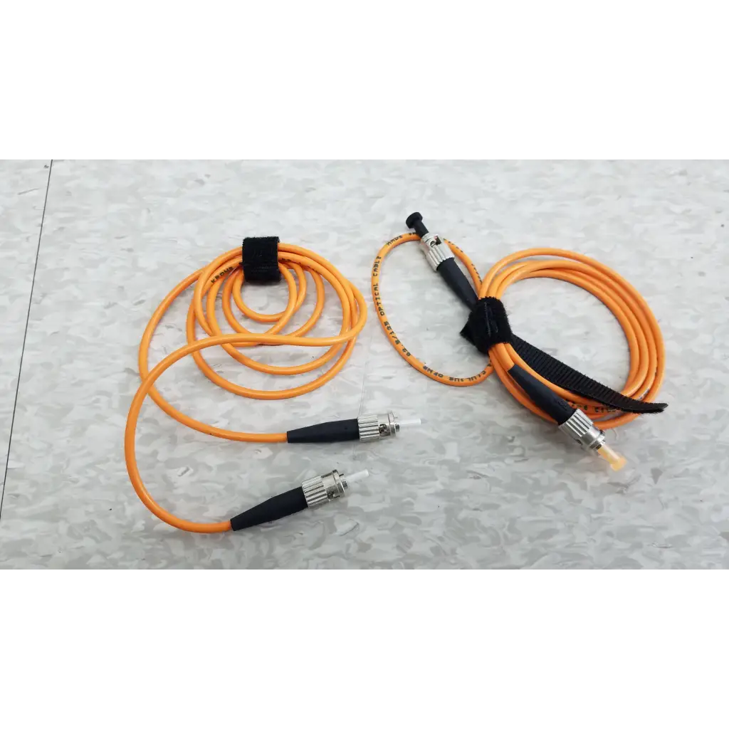 Orange fiber optic cables with black connectors and velcro ties for fluke networks fos 850 1300 fiber optic source