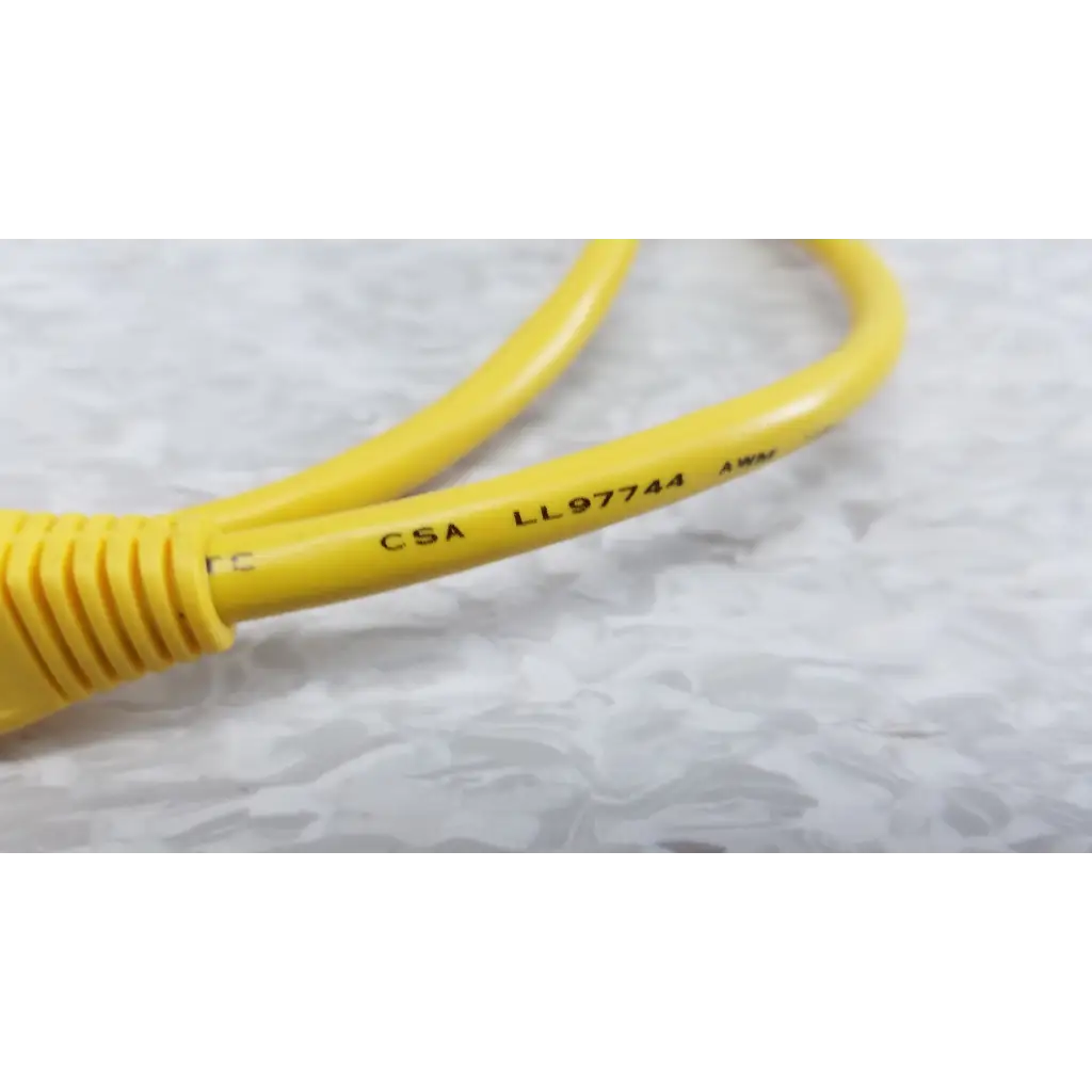 Yellow ethernet cable with ribbed connector and certification markings included with fluke networks fiber optic source kit