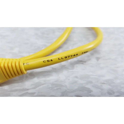 Yellow ethernet cable with ribbed connector and certification markings included with fluke networks fiber optic source kit