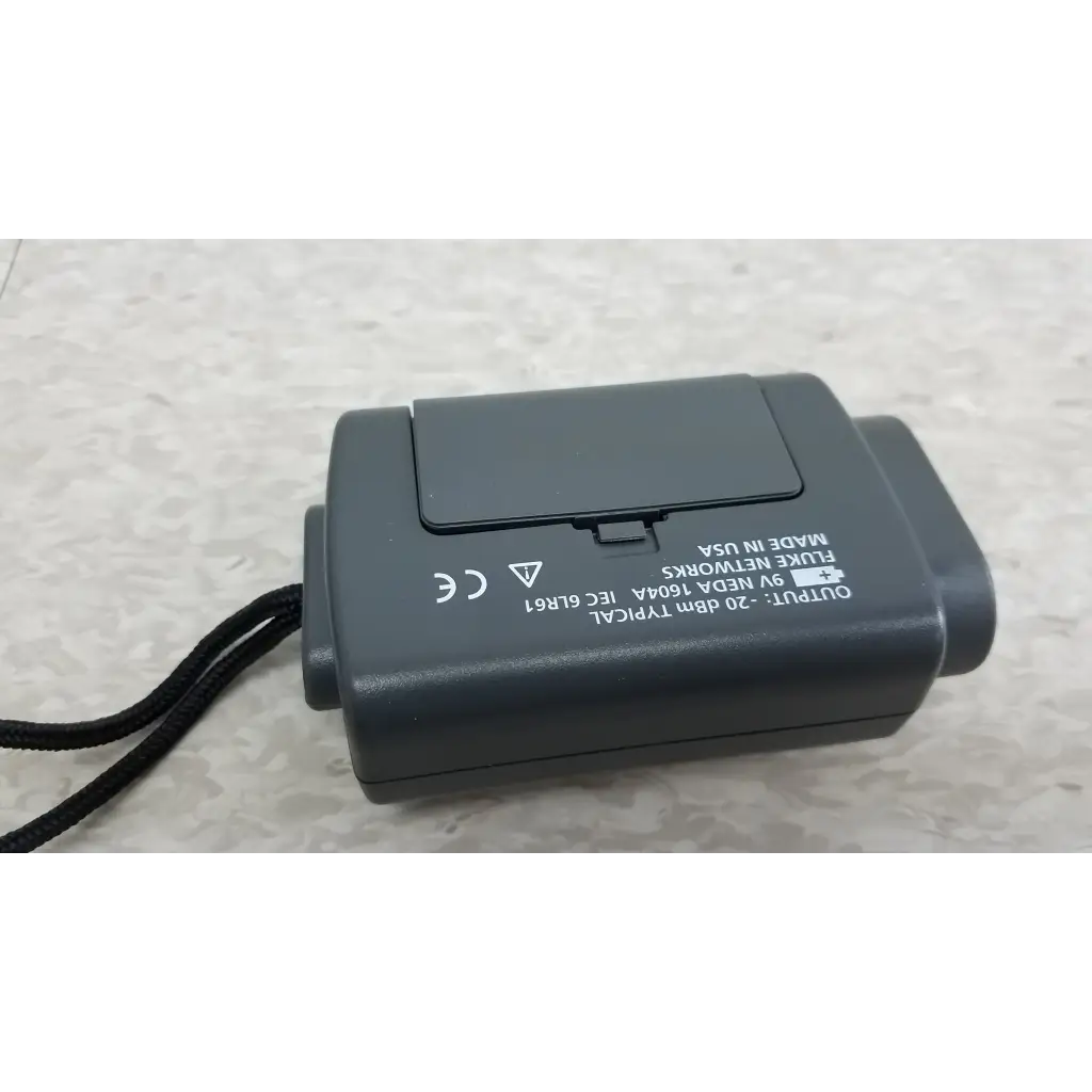 Black plastic fluke networks battery pack with lanyard for fiber optic source in fluke networks fos 850 1300 kit