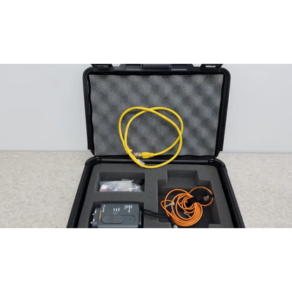 Black rugged case with fluke networks fiber optic source and yellow ethernet and orange coiled cables in foam slots