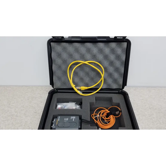 Black rugged case with fluke networks fiber optic source and yellow ethernet and orange coiled cables in foam slots