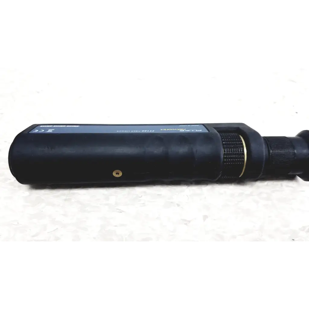 Black cylindrical fiber optic test kit with textured grip and metallic accents fluke networks ftk1300 simplifiber pro device