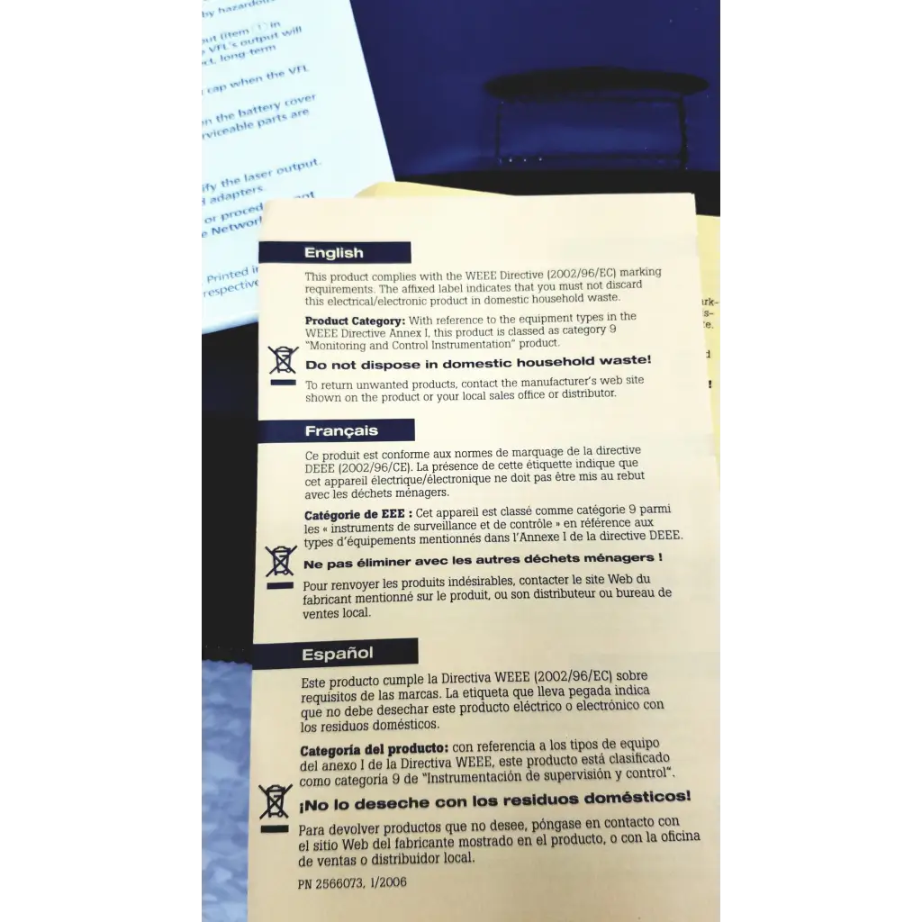White paper label with black text showing multilingual electronic waste disposal instructions on the back of ftk1300 simplifiber pro fiber optic test kit