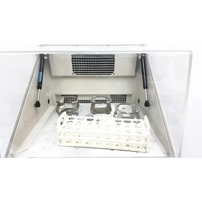 White plastic test tube rack with metallic holders inside a lab fume hood for forma scientific orbital shaker 4518