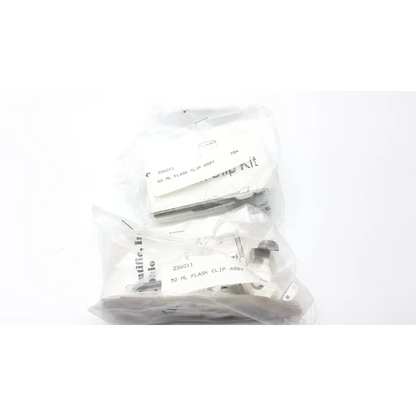 Two clear plastic bags holding silver metal 50 ml flask clip assemblies for forma scientific orbital shaker 4518