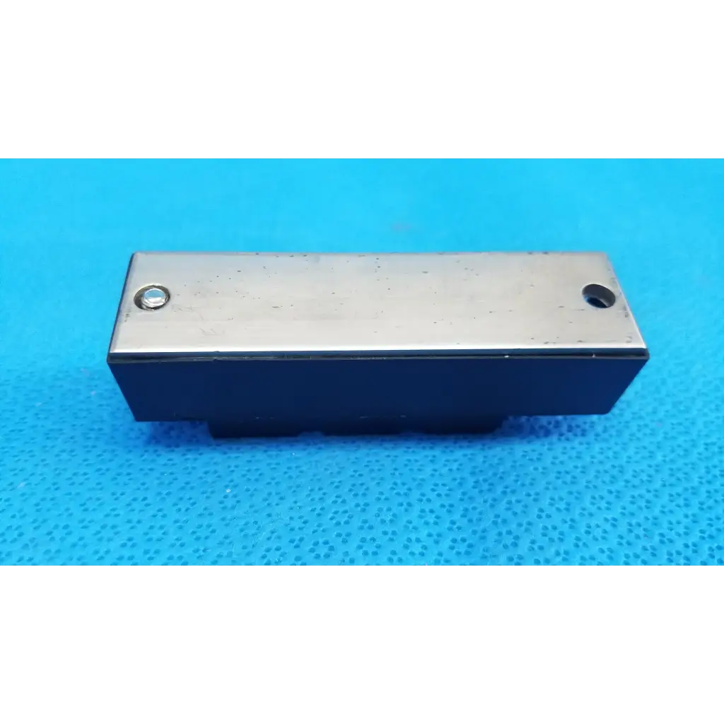 Rectangular fuji electric power diode module dual diode block with silver top and black base featuring two holes