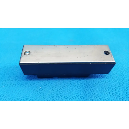 Rectangular fuji electric power diode module dual diode block with silver top and black base featuring two holes