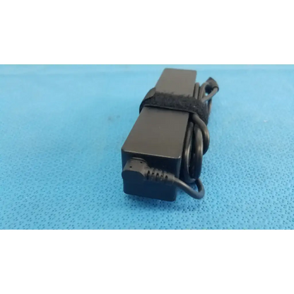 Black rectangular fujitsu ac adapter power supply 19v 3.16a with coiled cord and black strap for laptop use