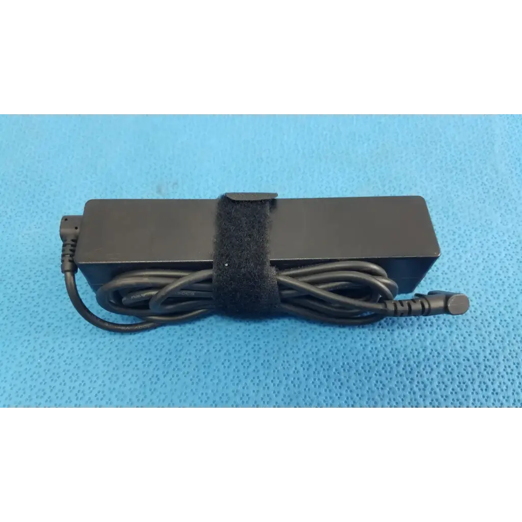 Black rectangular fujitsu ac adapter power supply 19v 3.16a with coiled cord and velcro strap for laptop charging