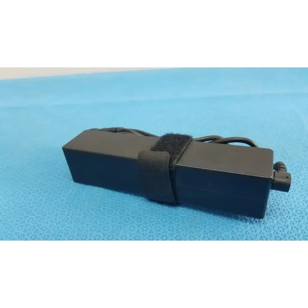 Black rectangular fujitsu ac adapter power supply 19v 3.16a with coiled power cord and black velcro strap