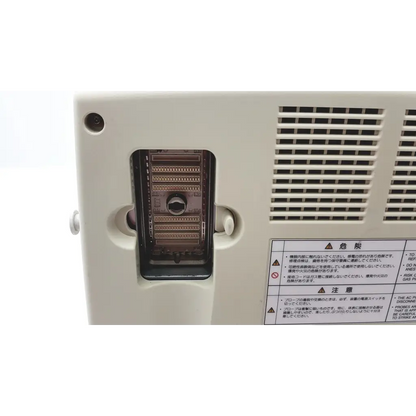 White plastic back panel of fukuda denshi uf-750xt portable ultrasound with black contacts and japanese warning labels