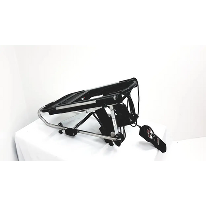 Black electric reclining chair with chrome frame and adjustable footrest by furniss corporation phoenix 1850 knee cpm
