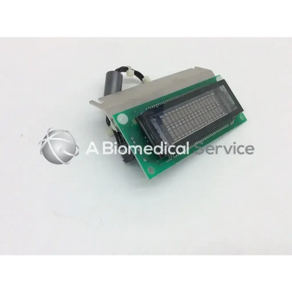 Green circuit board with black rectangular display and silver housing featuring a cylindrical component for futaba us162sd03cc display module