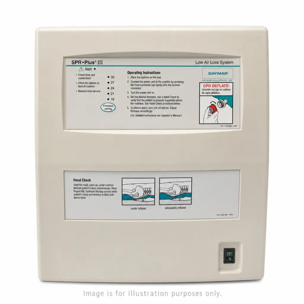 Beige rectangular spr plus iii medical device by gaymar industries with instructional panels and power switch for mattress pump