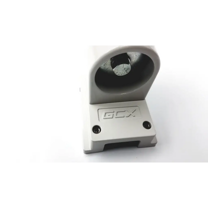 Gray plastic gcx wmm-0006-01 pivot arm mounting bracket with circular recess housing a metallic component
