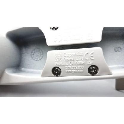White plastic label with engraved scx corporation logo and contact info on the back of gcx wmm-0006-01 pivot arm