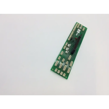Green rectangular datex engstrom connection board with multiple white connectors and black ribbon cable bbcf4-4