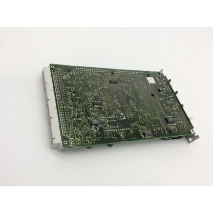 Green printed circuit board with silver soldered traces and black integrated circuits in datex ohmeda b-cpu4 main sw adu