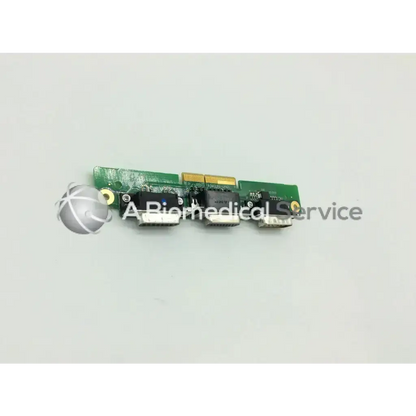 Green circuit board with three black usb ports and gold connector on the back of engstrom carestation cs ventilator aisys model