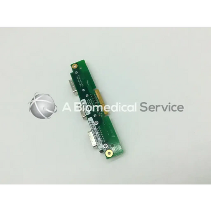Green circuit board with gold-plated connectors and silver ports on the back of engstrom carestation cs ventilator aisys model