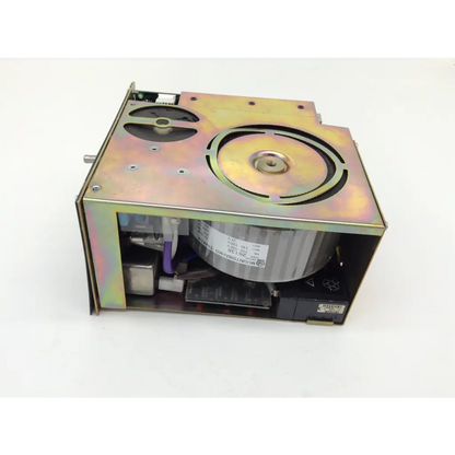 Iridescent metal housing with internal fan and circuitry and circular ventilation grille on top for datex ohmeda engstrom f-cu8-28-03