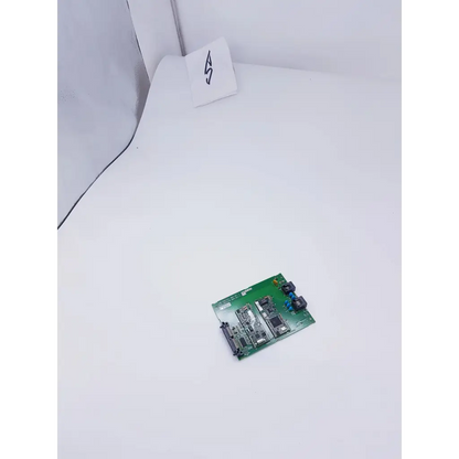 Green mac5500 xm pcb assy communication board by GE Healthcare featuring electronic components and connectors
