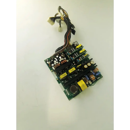 Green circuit board with black and yellow capacitors copper coils and multi colored wires of healthcare aps400w ultrasound board