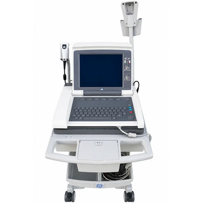 White ge mac 5500 ecg analysis system on mobile cart with laptop monitor and ultrasound probe attached
