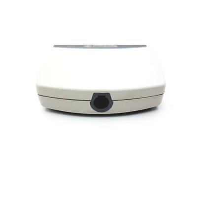 Beige plastic remote control with a black circular button for ge marquette m2mf8944p acquisition module