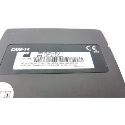 Black ge medical system cam-14 ecg acquisition module with white label showing serial and reference numbers