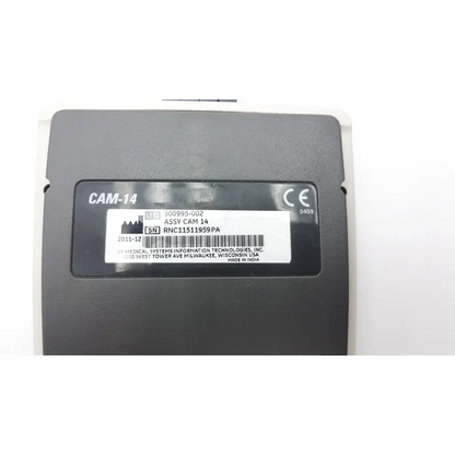 Black plastic GE Medical System CAM-14 ecg acquisition module with white label showing serial number and manufacturer details