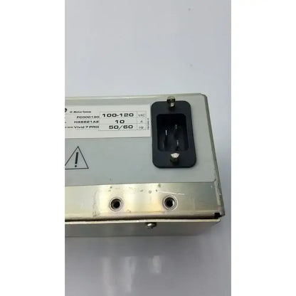 Silver metallic medical vivid 7 pro power supply with black ac input socket and white specification label back side