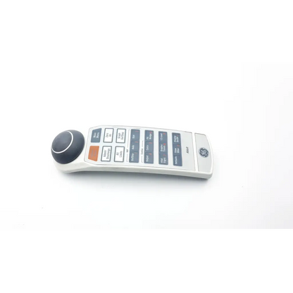 Silver ge neonatal solar 8000m remote control with black circular dial and gray buttons for solar 8000m devices