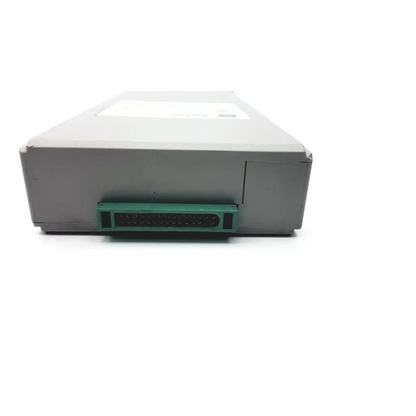 Gray external scsi hard drive with green connector port on the back of ge solar bis eeg module for patient monitoring