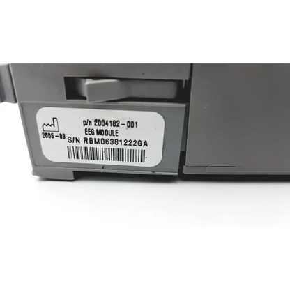 Gray plastic solar bis eeg module with white label showing part number serial number and barcode for patient monitor