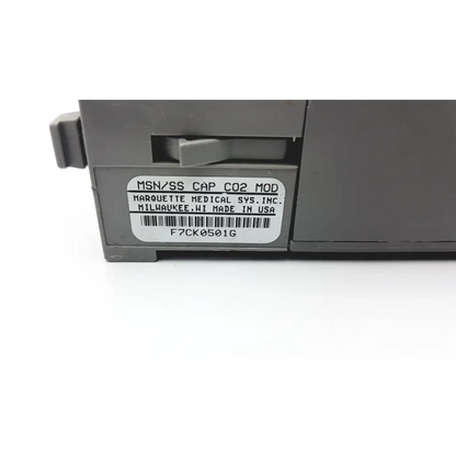Gray plastic solar capnostat mainstream cap co2 module labeled marquette medical sys for respiratory monitoring