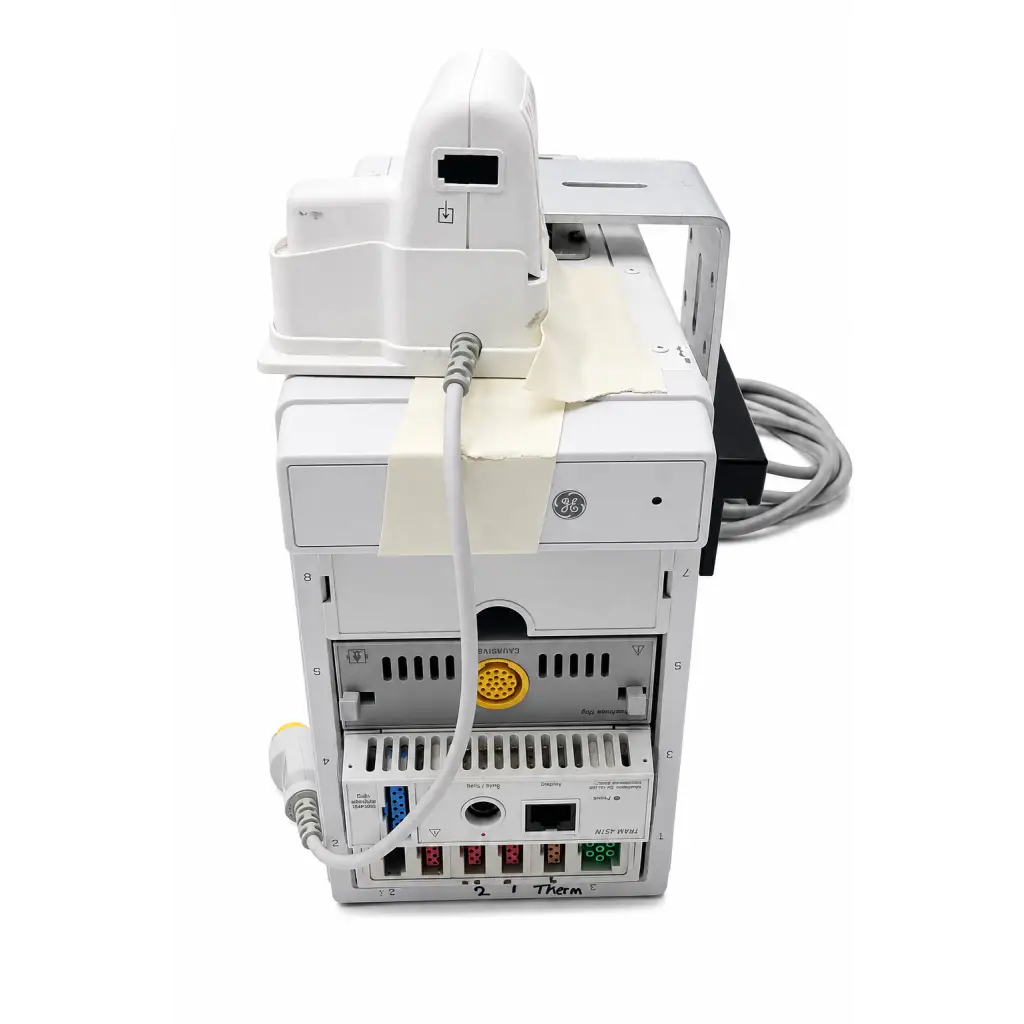 Back side of white ge tram 451n patient monitoring module with yellow port and multiple connectivity interfaces biomed certified