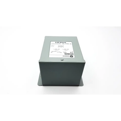 Gray metal ge transformer 9t51b0030 with white label and barcode on top for electrical use